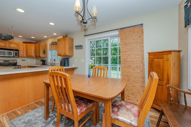 20 Brenda Ln, Rochester, NH 03867 - dining area featuring light wood-style flooring, a chandelier, and recessed lighting