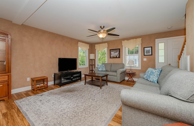 20 Brenda Ln, Rochester, NH 03867 - living room featuring ceiling fan, light wood-style floors, and stairway