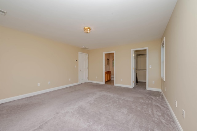 20 Brenda Ln, Rochester, NH 03867 - unfurnished bedroom featuring carpet, a walk in closet, and ensuite bathroom