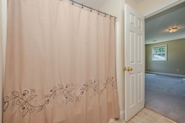 20 Brenda Ln, Rochester, NH 03867 - full bath with baseboards and a shower with shower curtain
