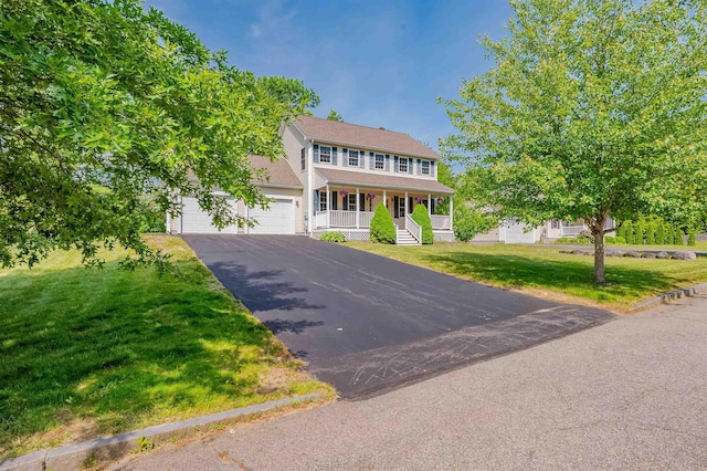 20 Brenda Ln, Rochester, NH 03867 - colonial house with a porch, asphalt driveway, and a front yard