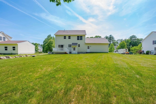20 Brenda Ln, Rochester, NH 03867 - back of house featuring a yard and a wooden deck