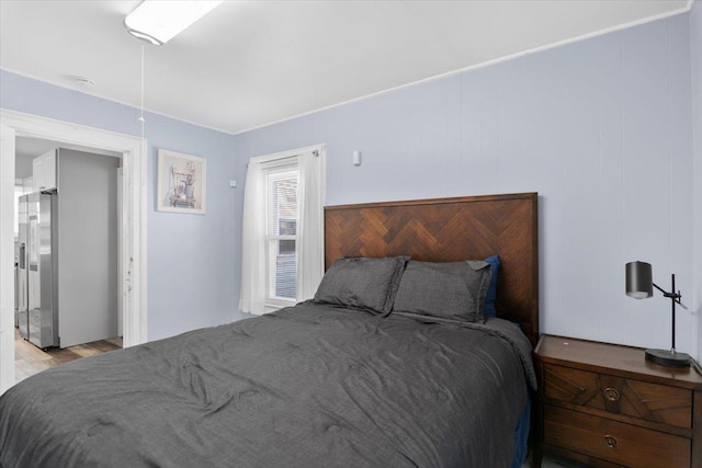 226 N St, Bennington, VT 05201 - bedroom with stainless steel refrigerator with ice dispenser and wood finished floors