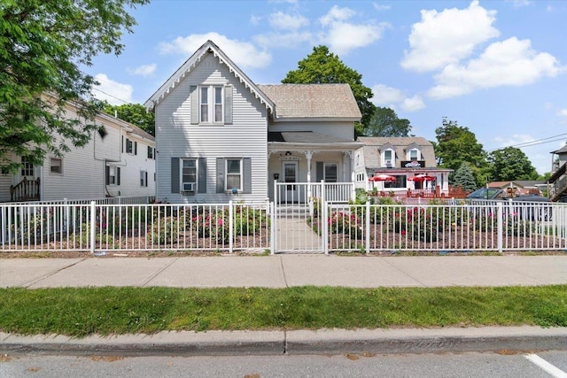 226 N St, Bennington, VT 05201 - view of front of house with a porch and a fenced front yard