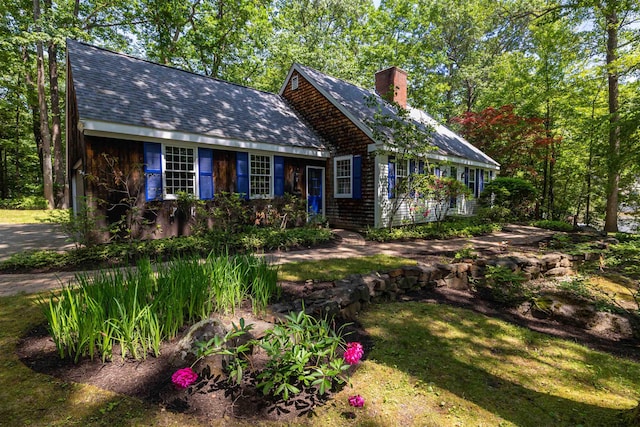 4 Spaulding St, Concord, NH 03301 - view of front of home with a chimney and a shingled roof