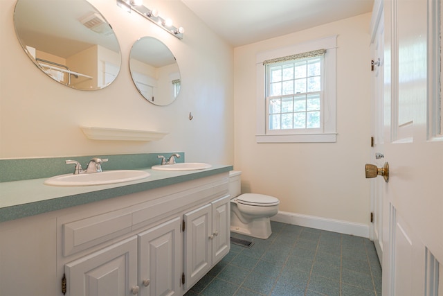 4 Spaulding St, Concord, NH 03301 - bathroom with double vanity and tile patterned flooring