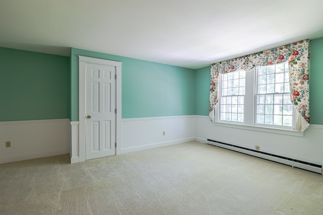 4 Spaulding St, Concord, NH 03301 - carpeted spare room featuring a baseboard heating unit
