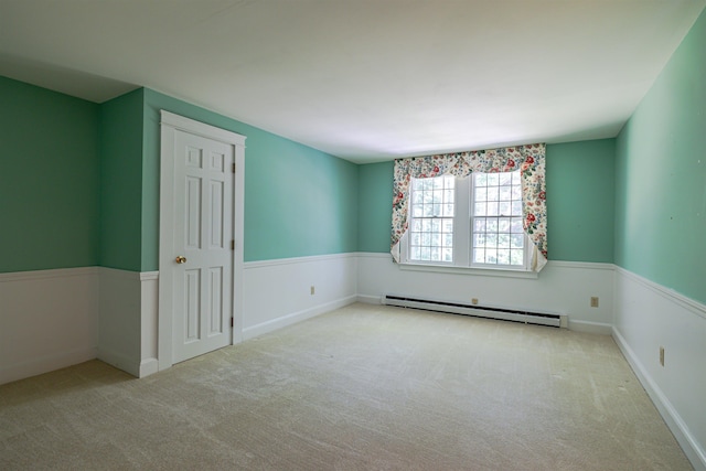4 Spaulding St, Concord, NH 03301 - spare room featuring a baseboard radiator and carpet