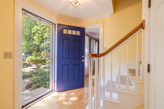 4 Spaulding St, Concord, NH 03301 - foyer entrance featuring crown molding, stairway, and light wood-style flooring