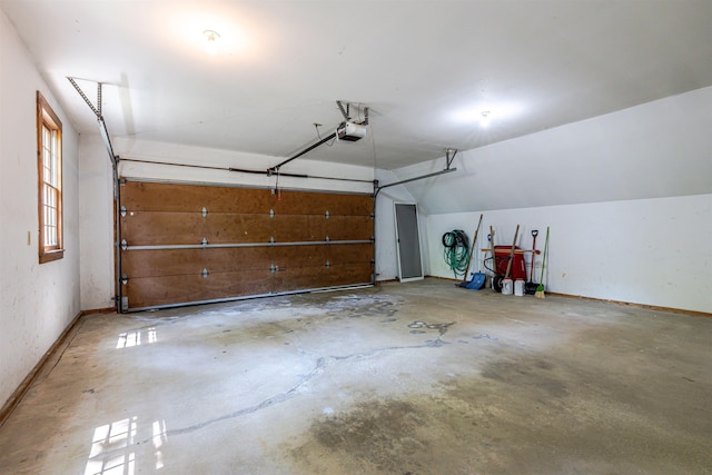 4 Spaulding St, Concord, NH 03301 - garage featuring a garage door opener and baseboards