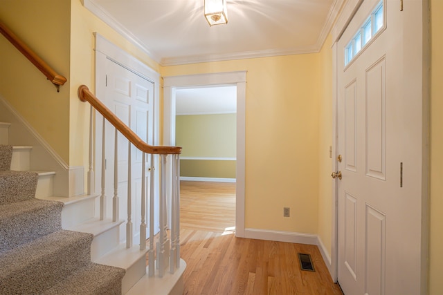 4 Spaulding St, Concord, NH 03301 - foyer featuring stairs, light wood-style flooring, and crown molding