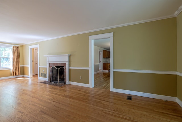 4 Spaulding St, Concord, NH 03301 - unfurnished living room featuring a fireplace, wood finished floors, and ornamental molding