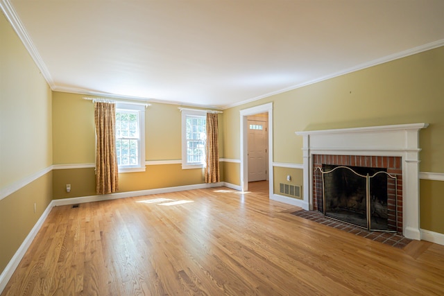 4 Spaulding St, Concord, NH 03301 - unfurnished living room featuring a brick fireplace, wood finished floors, and ornamental molding