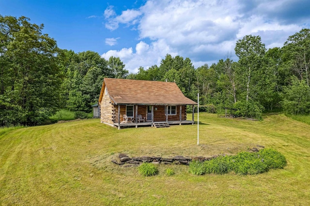 28 New Brighton Hill Rd, Tunbridge, VT 05077 - back of property with covered porch, a lawn, log siding, and a forest view