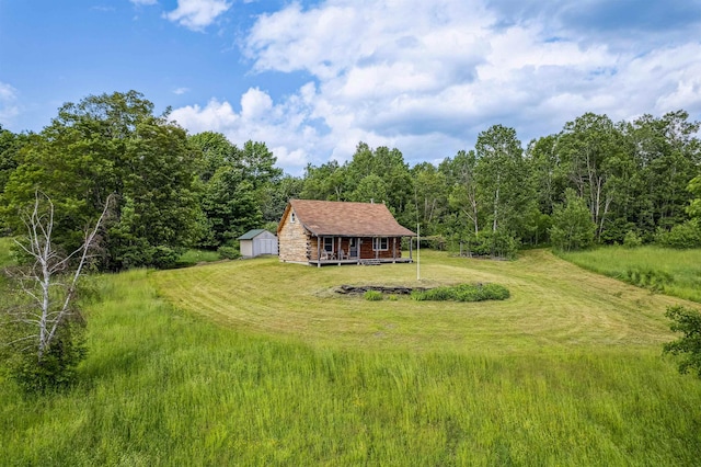 28 New Brighton Hill Rd, Tunbridge, VT 05077 - view of green lawn with an outbuilding and a view of trees