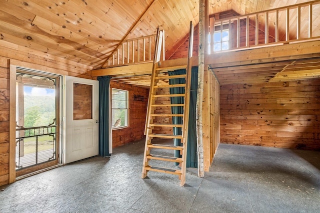 28 New Brighton Hill Rd, Tunbridge, VT 05077 - stairway with plenty of natural light, wooden walls, carpet, wood ceiling, and high vaulted ceiling