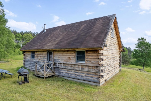28 New Brighton Hill Rd, Tunbridge, VT 05077 - back of house featuring a shingled roof, a lawn, and log exterior