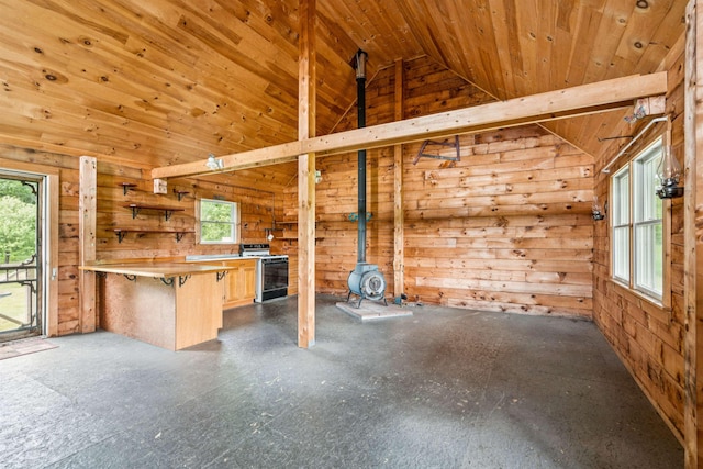 28 New Brighton Hill Rd, Tunbridge, VT 05077 - unfurnished living room with vaulted ceiling, healthy amount of natural light, wooden walls, and wood ceiling