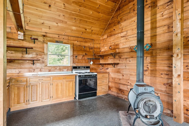 28 New Brighton Hill Rd, Tunbridge, VT 05077 - kitchen with gas stove, lofted ceiling, wooden ceiling, a wood stove, and wooden walls