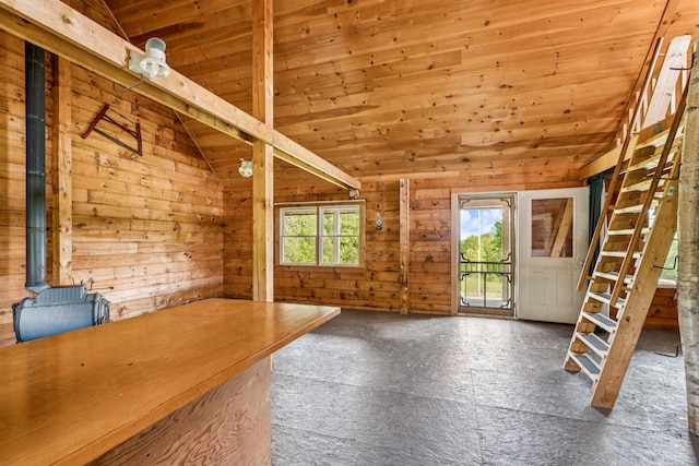 28 New Brighton Hill Rd, Tunbridge, VT 05077 - entryway featuring lofted ceiling, wooden ceiling, plenty of natural light, a wood stove, and wooden walls