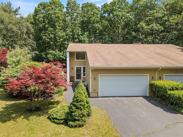 13 Judith Dr, Concord, NH 03301 - view of front facade featuring asphalt driveway, a garage, and a shingled roof
