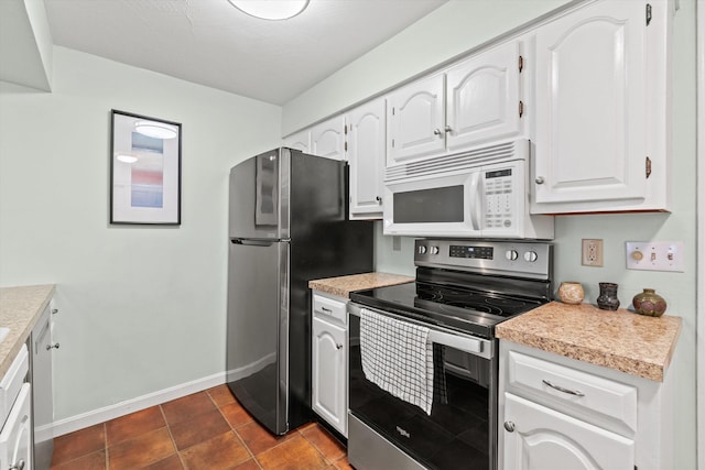 13 Judith Dr, Concord, NH 03301 - kitchen with stainless steel appliances, white cabinets, and light countertops