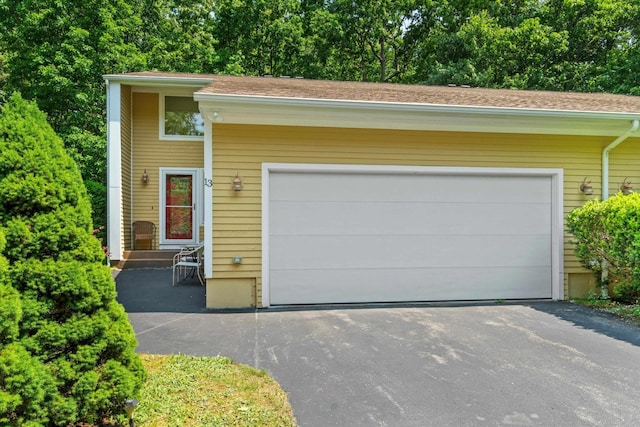 13 Judith Dr, Concord, NH 03301 - view of front of house featuring driveway, an attached garage, and roof with shingles