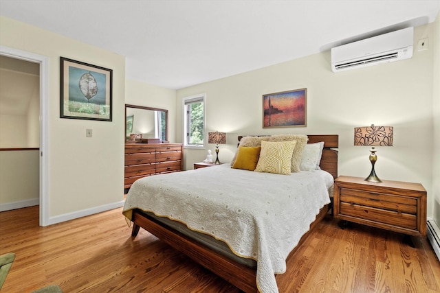 13 Judith Dr, Concord, NH 03301 - bedroom with a wall mounted air conditioner and wood finished floors