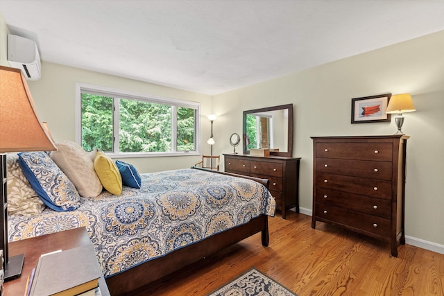 13 Judith Dr, Concord, NH 03301 - bedroom featuring a wall unit AC and wood finished floors