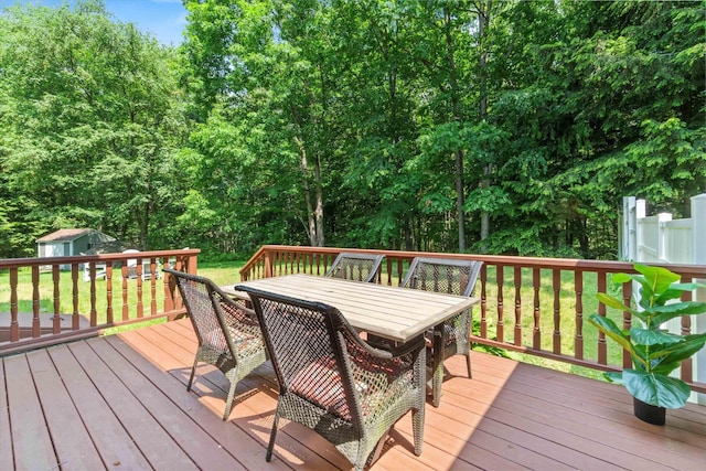 13 Judith Dr, Concord, NH 03301 - wooden terrace with outdoor dining space, a lawn, and a storage shed