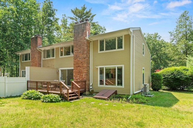 13 Judith Dr, Concord, NH 03301 - rear view of house with a chimney and a wooden deck