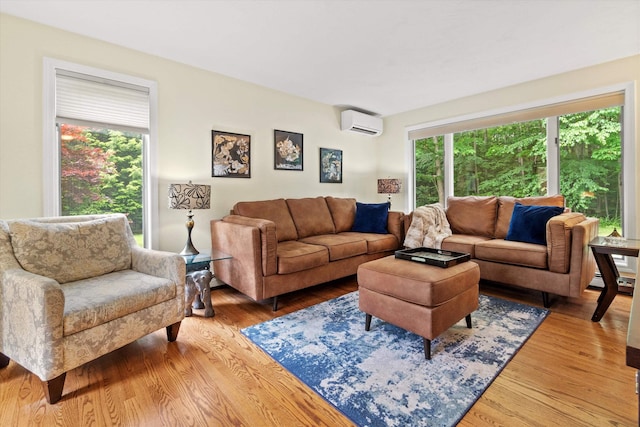 13 Judith Dr, Concord, NH 03301 - living room featuring a wall mounted AC and light wood-style flooring