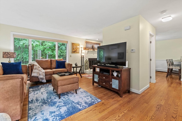 13 Judith Dr, Concord, NH 03301 - living area featuring light wood-style floors and a fireplace