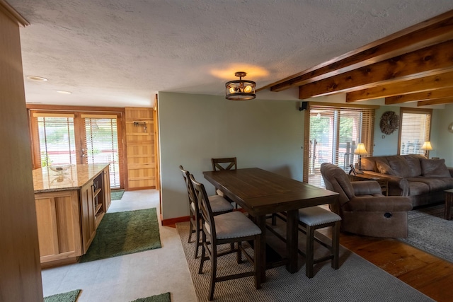 14 Mountain Ridge Rd, Ossipee, NH 03814 - dining area with a textured ceiling and healthy amount of natural light