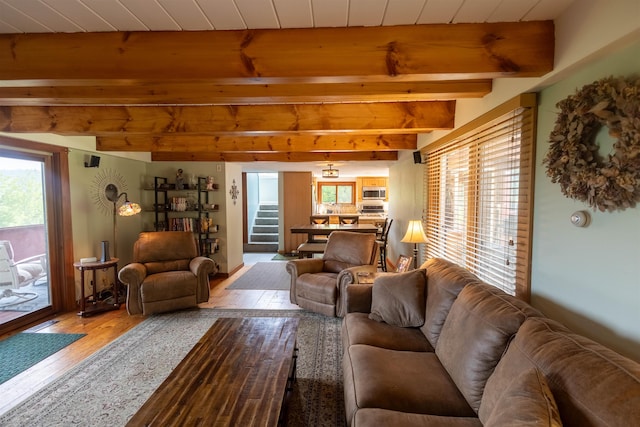 14 Mountain Ridge Rd, Ossipee, NH 03814 - living area featuring wood-type flooring, beam ceiling, and stairs