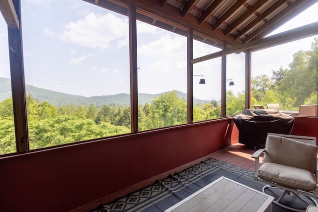 14 Mountain Ridge Rd, Ossipee, NH 03814 - sunroom featuring a view of trees, wood finished floors, and a mountain view