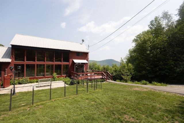14 Mountain Ridge Rd, Ossipee, NH 03814 - rear view of house with a lawn, a metal roof, and a mountain view