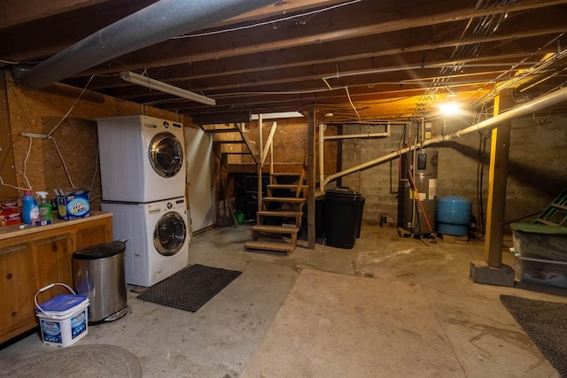 14 Mountain Ridge Rd, Ossipee, NH 03814 - unfinished below grade area featuring stacked washing machine and dryer, a water pressure tank, and water heater
