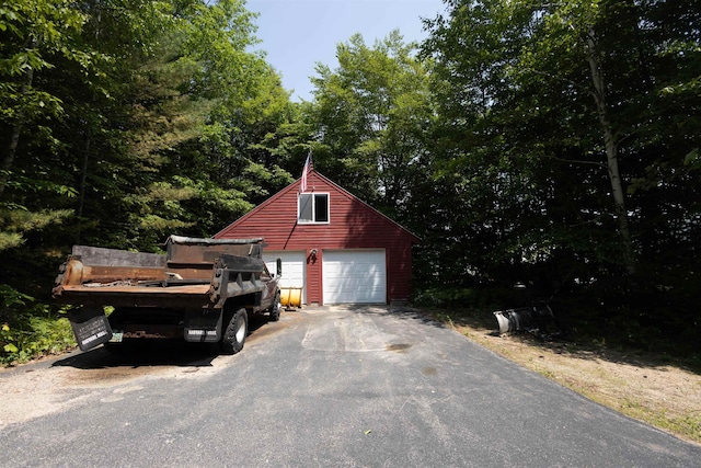 14 Mountain Ridge Rd, Ossipee, NH 03814 - view of side of property featuring a detached garage and an outbuilding