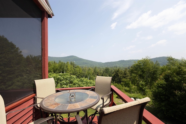 14 Mountain Ridge Rd, Ossipee, NH 03814 - balcony featuring a view of trees, a mountain view, and outdoor dining space