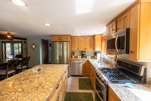 14 Mountain Ridge Rd, Ossipee, NH 03814 - kitchen with appliances with stainless steel finishes, light stone counters, recessed lighting, a ceiling fan, and brown cabinets