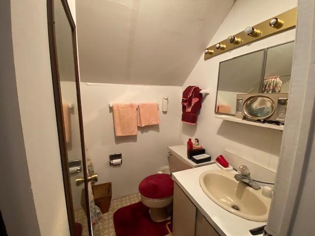 126 Crescent Lake Rd, Acworth, NH 03601 - bathroom with lofted ceiling and vanity