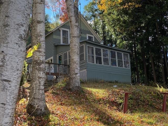 126 Crescent Lake Rd, Acworth, NH 03601 - view of side of home with a sunroom
