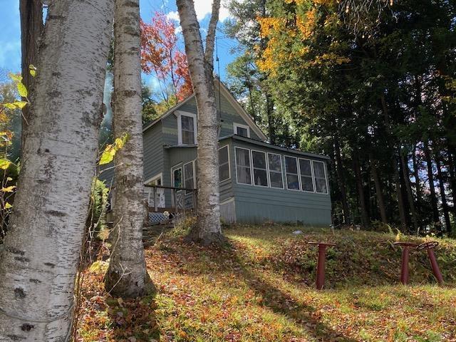 126 Crescent Lake Rd, Acworth, NH 03601 - view of home's exterior with a sunroom