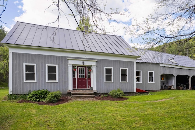 103 Potash Hill Rd, Tunbridge, VT 05077 - rear view of house featuring a standing seam roof, a metal roof, a yard, and a chimney