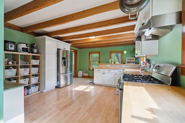 103 Potash Hill Rd, Tunbridge, VT 05077 - kitchen with appliances with stainless steel finishes, beamed ceiling, white cabinets, a peninsula, and light wood-type flooring