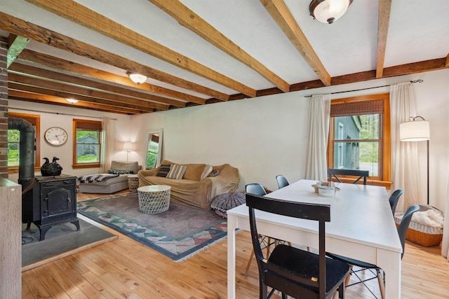 103 Potash Hill Rd, Tunbridge, VT 05077 - living room featuring beamed ceiling, a wood stove, and hardwood / wood-style floors
