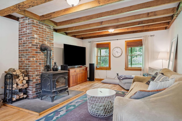 103 Potash Hill Rd, Tunbridge, VT 05077 - living room featuring a wood stove, light wood-style flooring, and beamed ceiling
