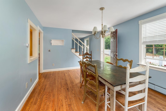 400 Turkey St, Tamworth, NH 03886 - dining space featuring a chandelier, plenty of natural light, stairway, and light wood-type flooring
