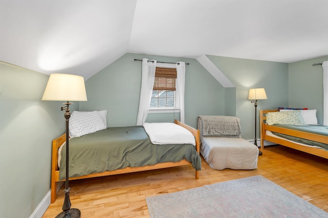 400 Turkey St, Tamworth, NH 03886 - bedroom featuring wood finished floors, vaulted ceiling, and a baseboard heating unit